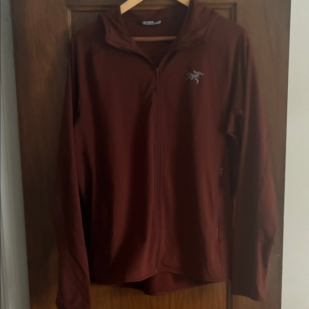 Arc'teryx Burgundy Adahy Zip-Up hoodie.
